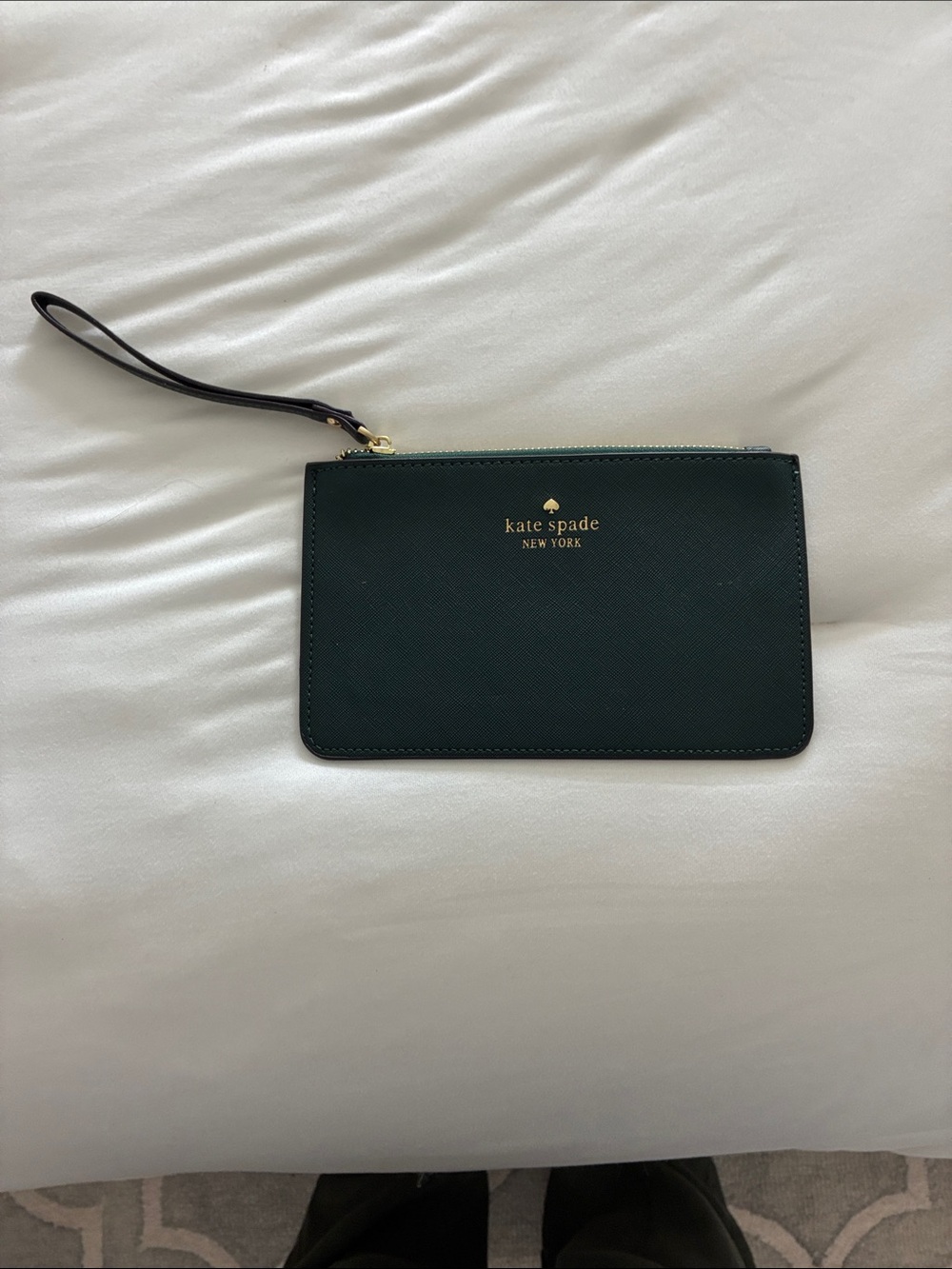 kate spade dark green saffiano wristlet with gold logo